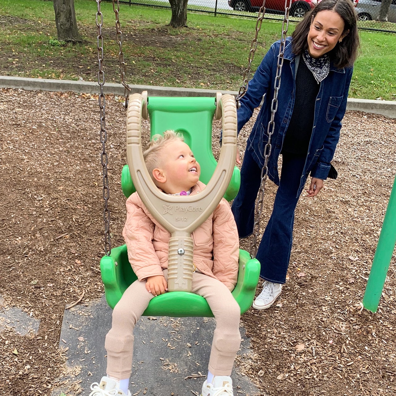 Alex and Oscar at the park swinging